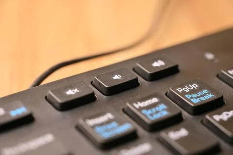 Black Computer Keyboard Macro Shot Highlighting Volume Increase Key with So.. Foto stock