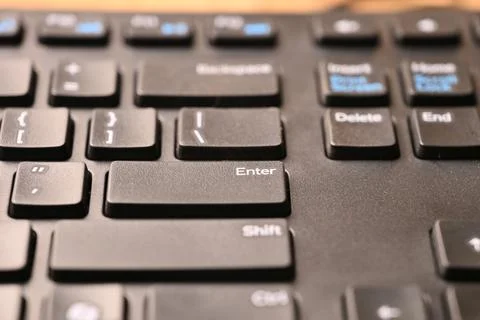Black Computer Keyboard Macro Shot Highlighting Enter Key with Angled Top V.. 스톡 사진