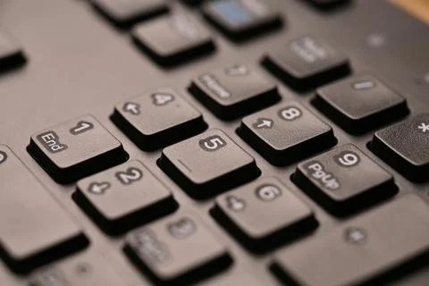 Black Computer Keyboard Macro Shot Highlighting Num Lock Area 5 Key on Nume.. Stock Photos