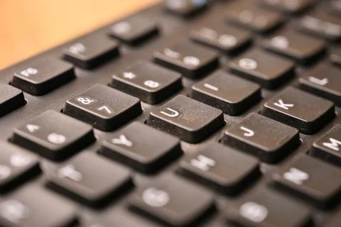 Black Computer Keyboard Macro Shot Highlighting U Key with Soft Blurred Bac.. 스톡 사진