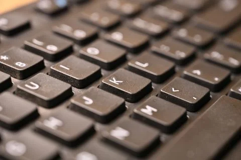 Black Computer Keyboard Macro Shot Highlighting K Key with Soft Blurred Bac.. 스톡 사진