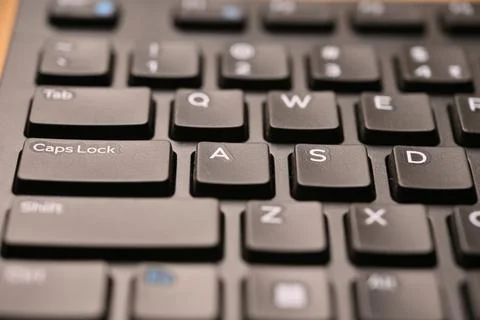 Black Computer Keyboard Macro Shot Highlighting A Key with Angled Top View .. Stock Photos