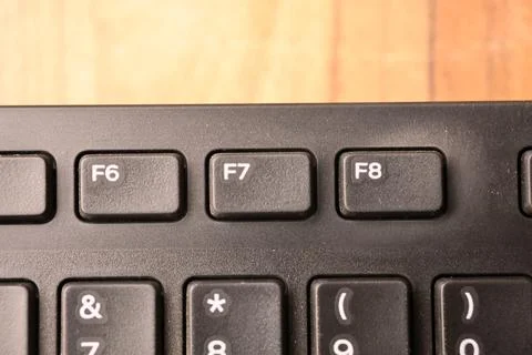 Black Computer Keyboard Macro Shot Highlighting F7 Key with Soft Blurred Ba.. Stock-Fotos
