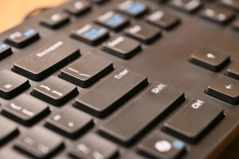 Black Computer Keyboard Macro Shot Highlighting Enter Key with Soft Blurred.. 스톡 사진
