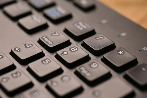 Black Computer Keyboard Macro Shot Highlighting Num Lock Area 8 Key on Nume.. Stock Photos