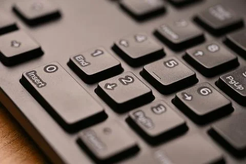 Black Computer Keyboard Macro Shot Highlighting Num Lock Area 2 Key on Nume.. Stock Photos