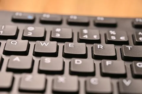 Black Computer Keyboard Macro Shot Highlighting E Key with Angled Top View .. 스톡 사진