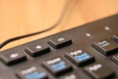 Black Computer Keyboard Macro Shot Highlighting Volume Increase Key with So.. 写真素材