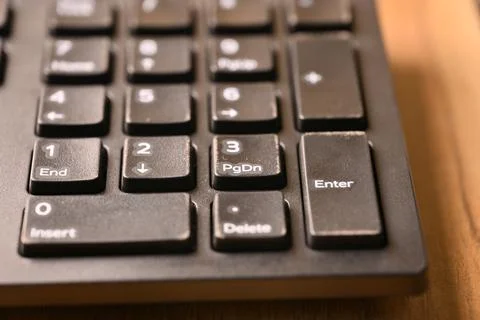 Black Computer Keyboard Macro Shot Highlighting 3 Key and Page Down Key on .. Stock Photos