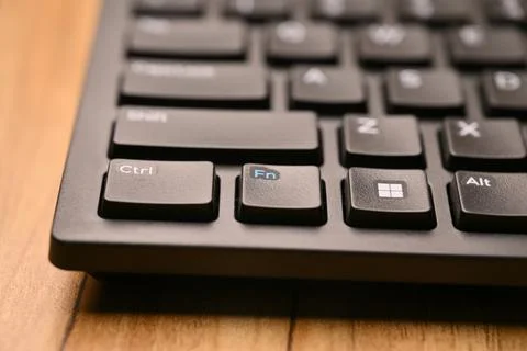 Black Computer Keyboard Macro Shot Highlighting Fn Key with Soft Blurred Ba.. Stock-Fotos