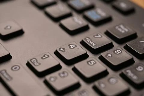 Black Computer Keyboard Macro Shot Highlighting Num Lock Area 4 Key on Nume.. Stock-Fotos