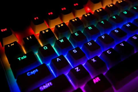 Black Computer Keyboard With Rainbow Led Lights 写真素材