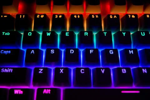 Black Computer Keyboard With Rainbow Led Lights Stock Photos