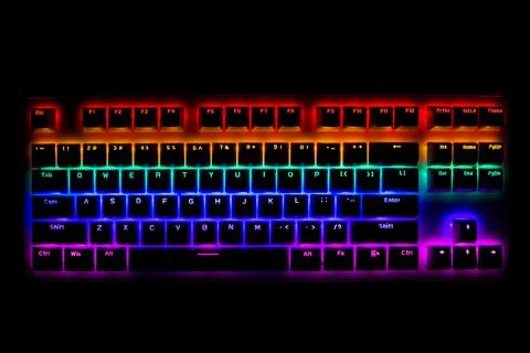 Black Computer Keyboard With Rainbow Led Lights Stock Photos