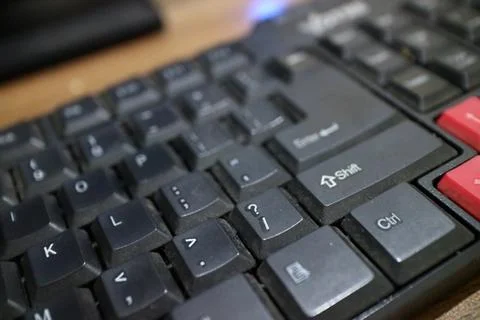 A black computer keyboard, slightly dusty Foto stock