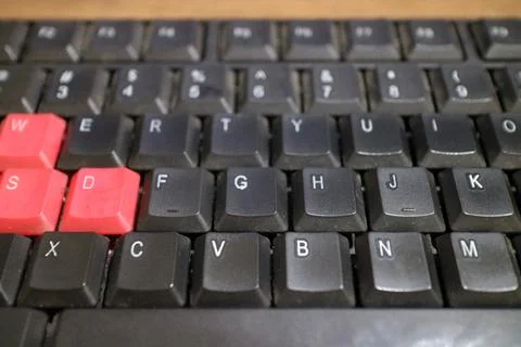 A black computer keyboard, slightly dusty Stock Photos