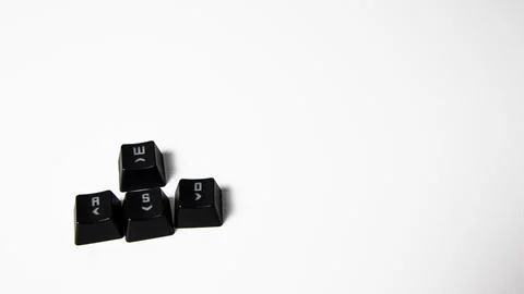Black computer keys on a white background with w,a,d and s letters. Gaming keys. Stock Photos