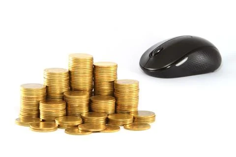 Black computer mouse and golden coin . Foto stock