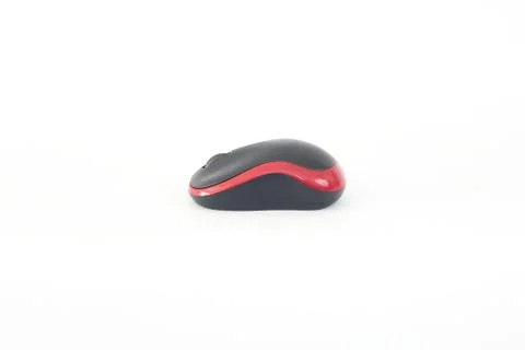 Black computer mouse on a red white background. Stock Photos