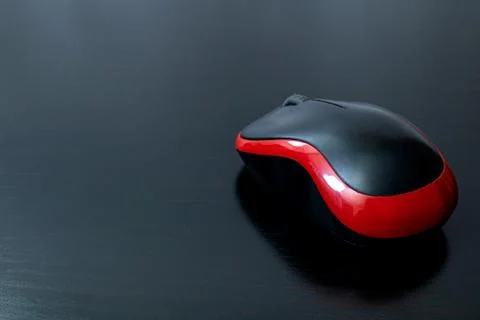 Black computer mouse on a wooden table Stock Photos