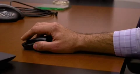 Black computer mouse on a work desk. Working with a PC clicking on the mouse. Video stock 156223843