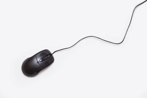 A black computer mousse with cable on a white background Stock Photos