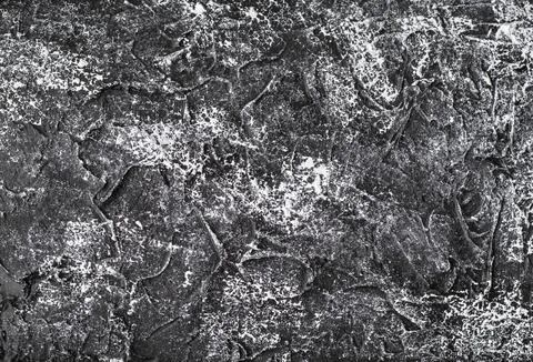 Black concrete with a white pattern, cement or plaster. Dark gray background or Stock Photos