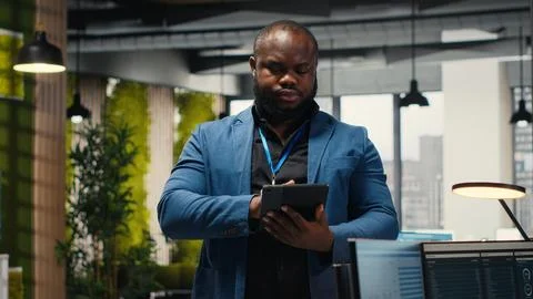Black consultant leverages analytics and report writing for forecast results Stock Photos
