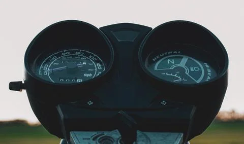 Black control panel and standard motorcycle speedometer Stock Photos