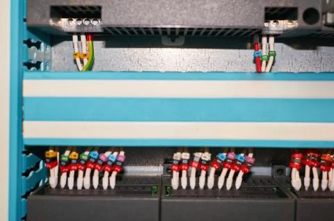 Black controller with connected colored numbered wires. Stock Photos