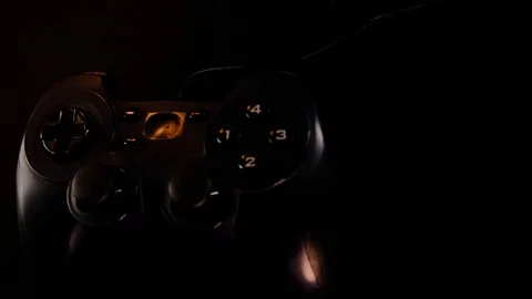 Black controller, gamepad to play video games on game console. Panoramic camera  Stock Footage 130055369