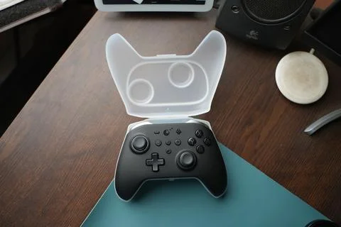 A black controller on a plastic box Stock Photos