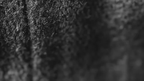 Black cotton cloth surface macro close up presentation slowly rotating stoc.. Stock Footage 344705763