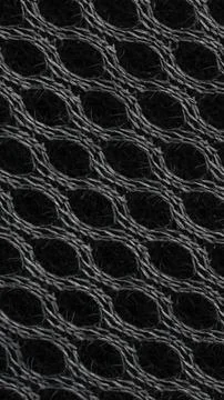 Black cotton fabric with a mesh pattern for visible details. background Stock Photos