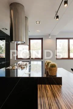 Black countertop in kitchen Stock Photos