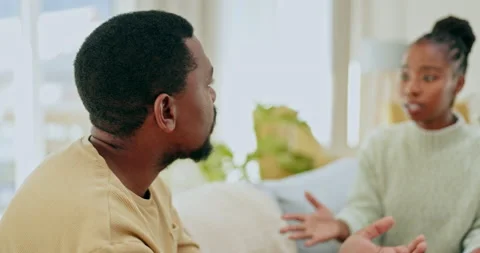 Black couple, argument and talking on sofa in disagreement, conflict or divorce Stock Footage 236090279