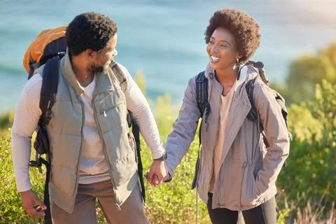 Black couple, happy and holding hands on hike journey for outdoor exploration Stock Photos