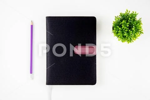 Black cover leather notebook or diary for reminder and memo and planner isola Stock Photos