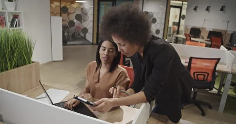 Black coworkers analyzing data together Stock Footage 195222712