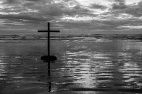Black cross beach Stock Photos