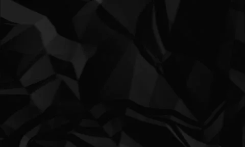Black crumpled paper texture background with sharp geometric folds . 스톡 사진