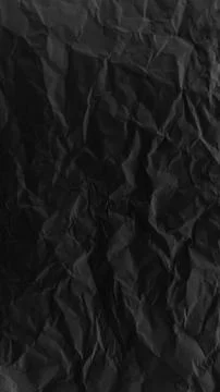 Black crumpled paper texture with deep folds and rich shadows, ideal for da.. イラスト素材