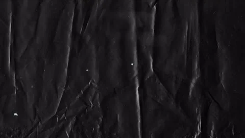 Black crumpled plastic texture background, animated background Video stock 333977491