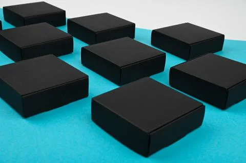 Black cubes flow. black boxes on blue. black boxes on a blue background on a  Stock Photos