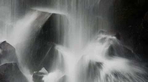 Black cubic basalt rocks under the falling water at Svartifoss, Iceland Stock Footage 33752347