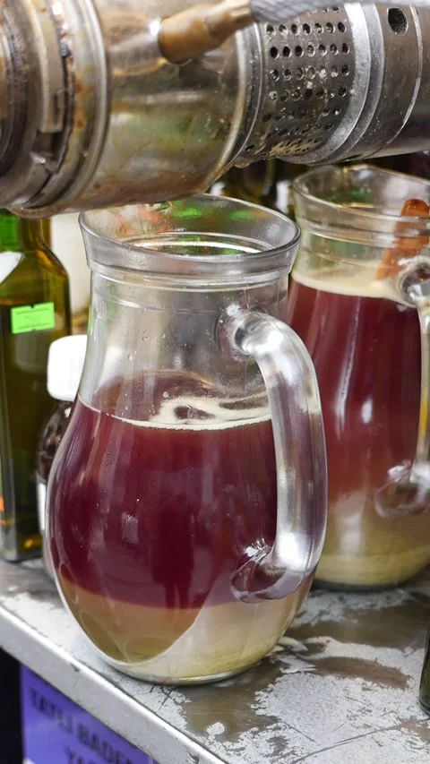 Black cumin seed oils pouring in a jar Video stock 336590738