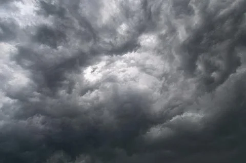 Black cumulus clouds before the beginning of a strong storm Stock Photos