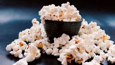 Black cup popcorn. Stock Photos