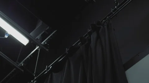 Black Curtain In Studio Is Pulled To One Side - Low Angle Shot Stock Footage 127247200