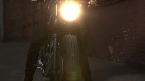 Black custom made cafe racer motorcycle bike. Handsome man sitting on a motor Video stock 61328784